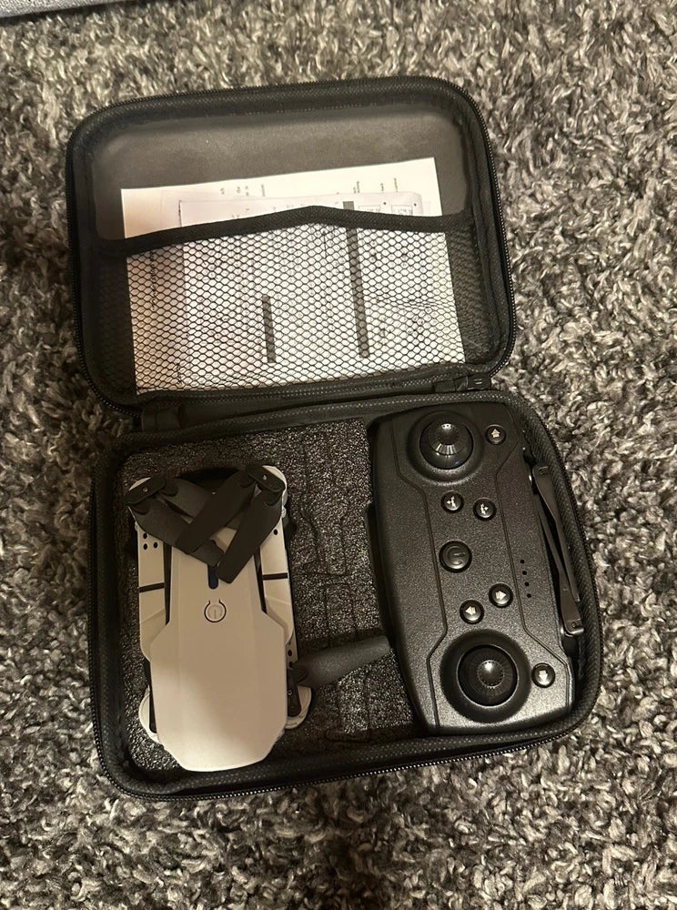 RC drone and controller in black zippered carrying case