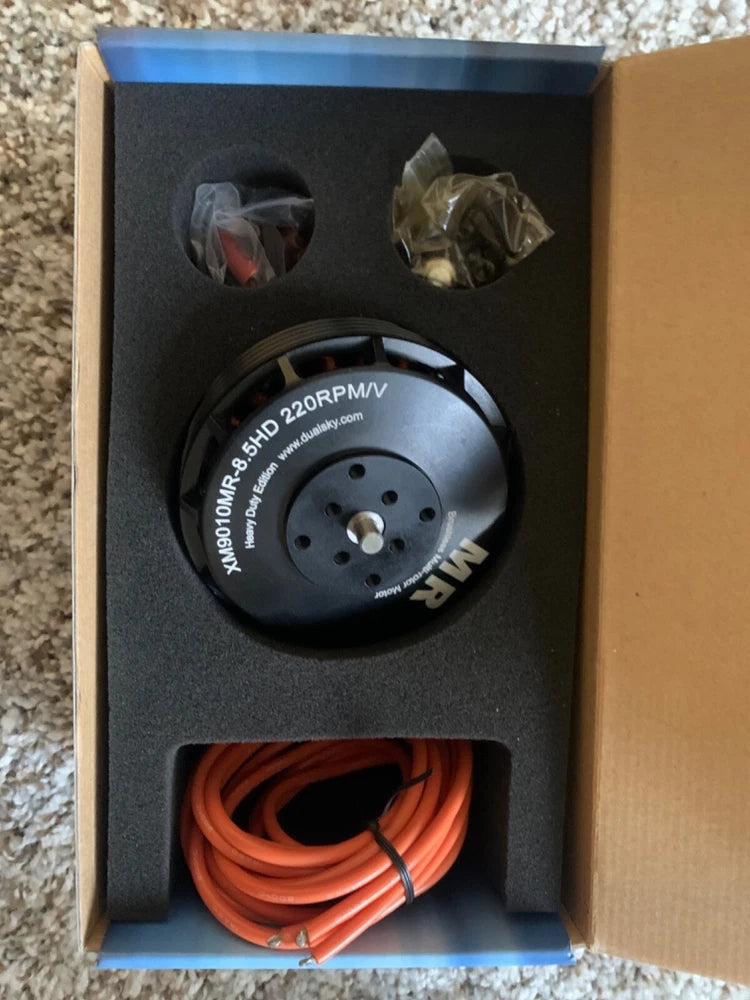 Dualsky XM9010MR brushless motor with 4-hole mount and orange wire set in box