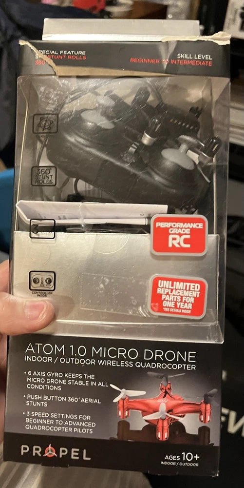 Atom 1.0 micro drone retail box with 4-rotor orange drone graphic