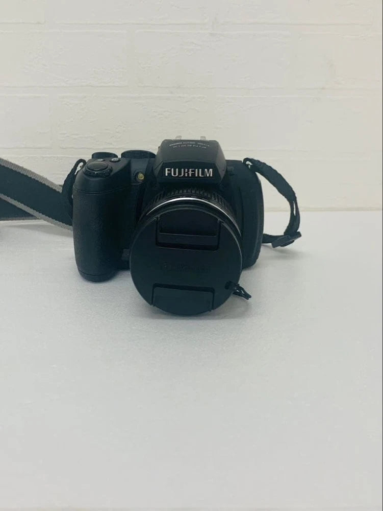 Fujifilm FinePix HS20EXR compact digital camera with lens and wrist strap