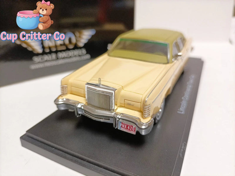 Yellow 1978 Lincoln Town Car 1:43 luxury sedan model with front grille, on display base