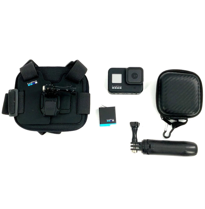Black action camera with mount, hand grip, waterproof housing, and zip pouch
