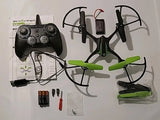 Black and green remote control stunt drone with four propellers and included accessories