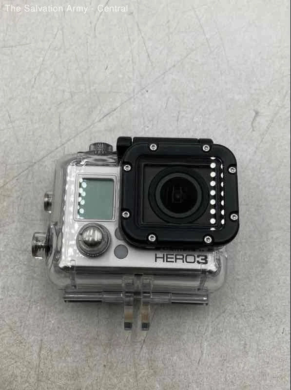 Waterproof action camera in clear case, black front with LCD screen and lens, HERO3 label