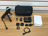 GoPro HERO10 Creator Edition action camera kit with camera, case, mounts, cables and papers