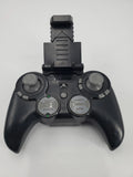 Black remote controller with two thumbsticks and top drone mount for parts