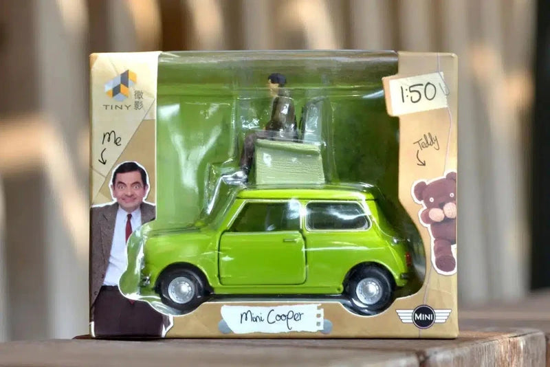 Boxed 1:50 scale green Mini Cooper model with Mr Bean figure on roof