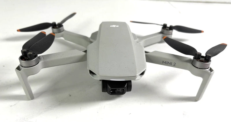 DJI Mini 2 quadcopter drone with four propellers and front camera