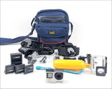 GoPro HERO4 action camera bundle with blue bag, mounts, batteries, charger, and housing