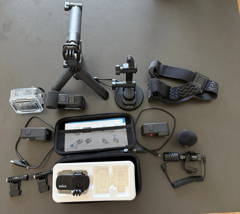 GoPro HERO9 Black action camera kit with mounts, battery door, and waterproof case
