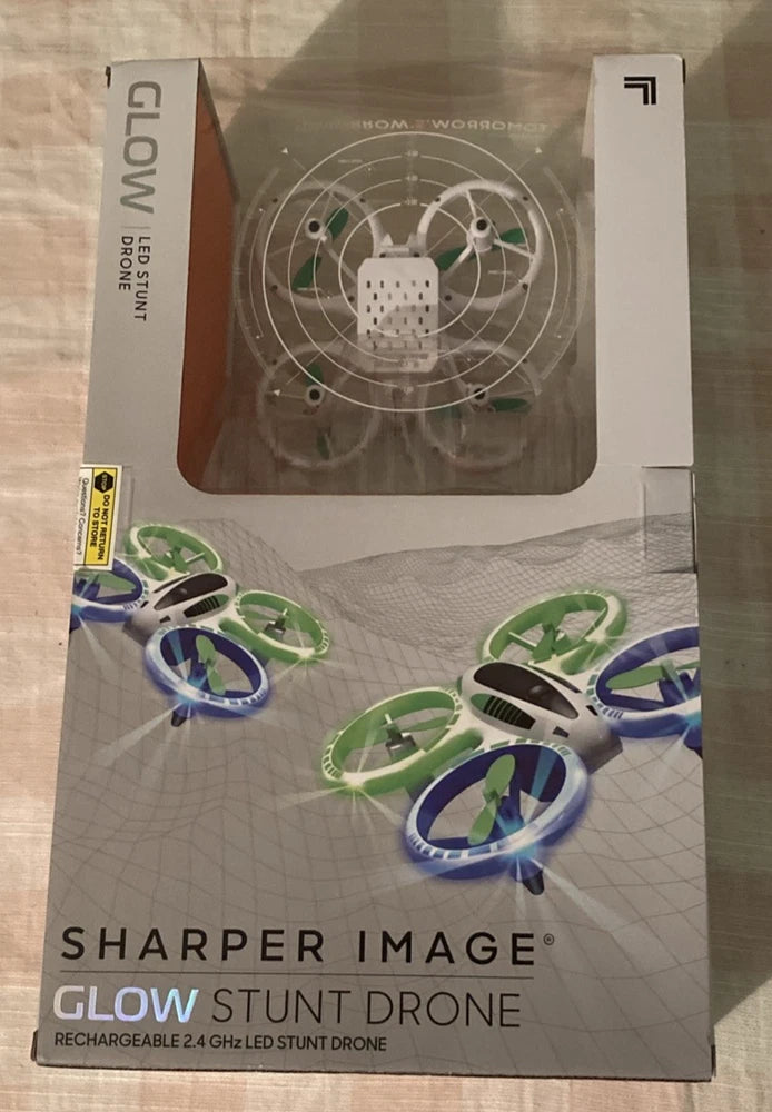 Sharper Image glow stunt drone box with green and blue LED lighted quadcopter