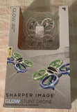 Sharper Image glow stunt drone box with green and blue LED lighted quadcopter