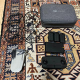 DJI Mavic drone with remote controller, three batteries, and gray carrying case