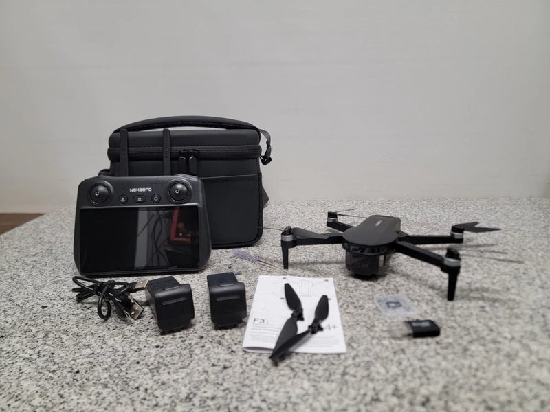 Foldable drone kit with camera, remote controller, carrying case, batteries and accessories