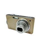 Gold Panasonic LUMIX compact digital camera with front lens and zoom ring