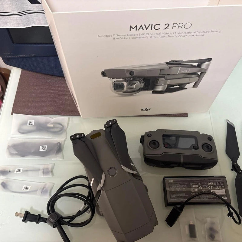 Drone bundle with Mavic 2 Pro drone, controller, battery, cables, and prop guards