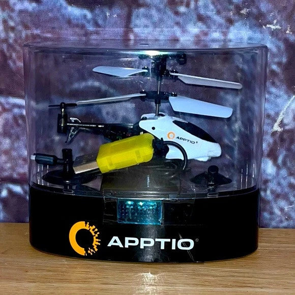 Mini RC helicopter drone with yellow and white body, shown in clear display box