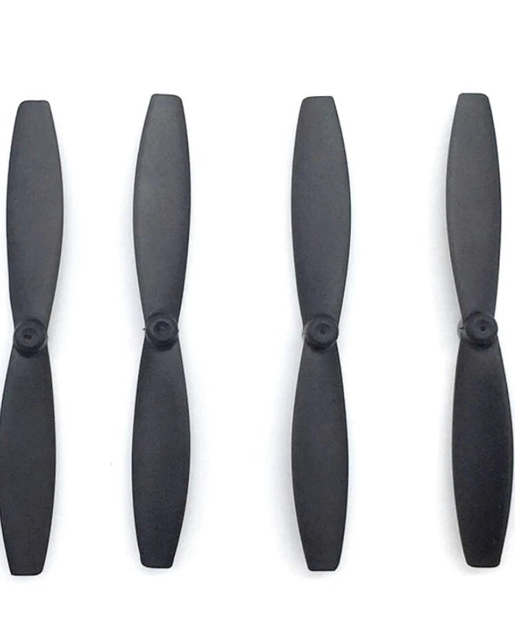 Set of four dark drone propeller blades with hubs