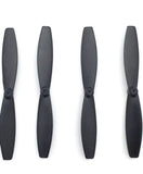 Set of four dark drone propeller blades with hubs