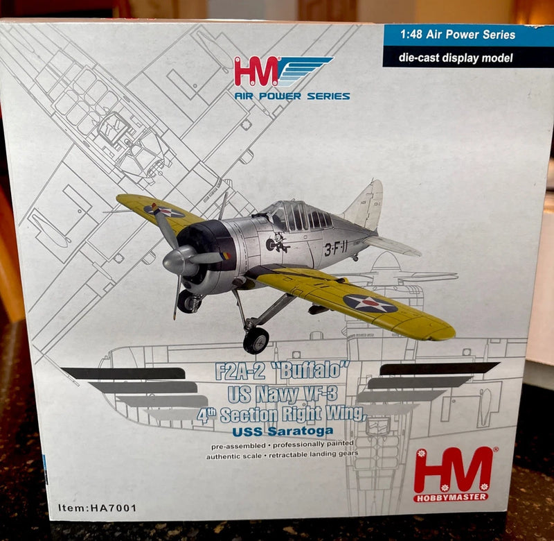 Die-cast aircraft model in box, gray and yellow with U.S. Navy markings