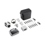 Camera drone kit with controller, batteries, propellers, and accessory bag