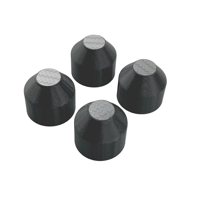 Set of dark hard-shell drone motor protective covers with textured top pads