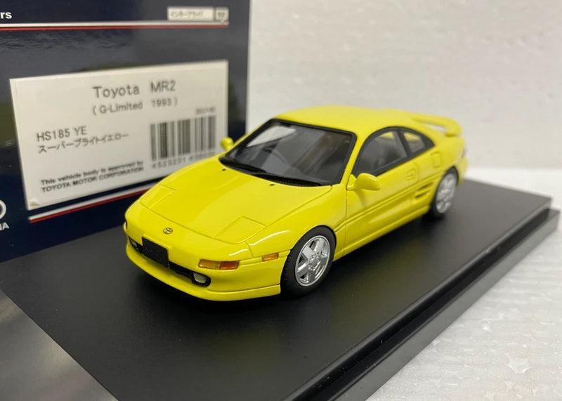 Yellow 1:43 scale sports model car with silver wheels, front three-quarter view