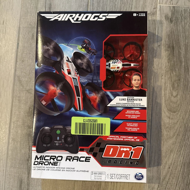 Micro race drone box with Luke Bannister branding and red remote controller