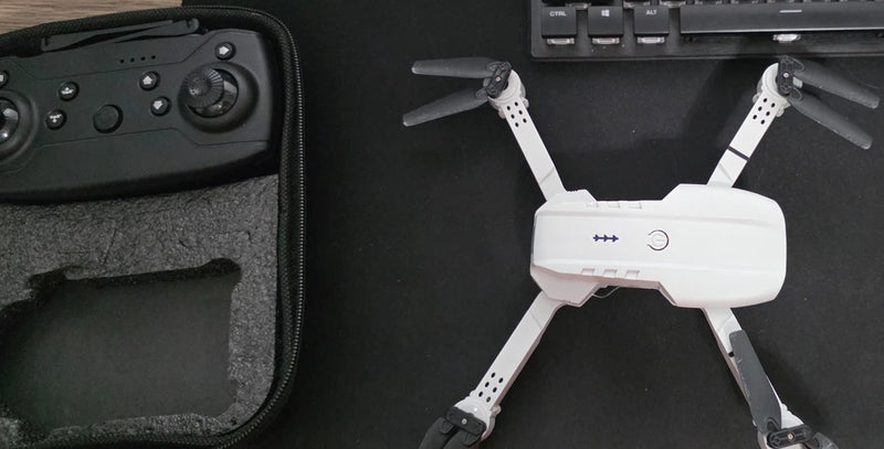 Foldable mini camera drone, white with four propellers