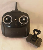 Black RC drone remote controller with dual joysticks and phone holder cradle