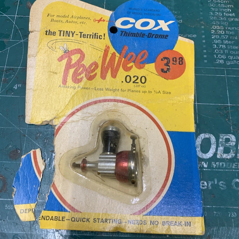 Cox Thimble-Drome Peewee .020 model airplane motor in yellow blister pack
