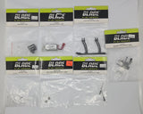 RC helicopter parts lot with multiple sealed Blade by Design packages