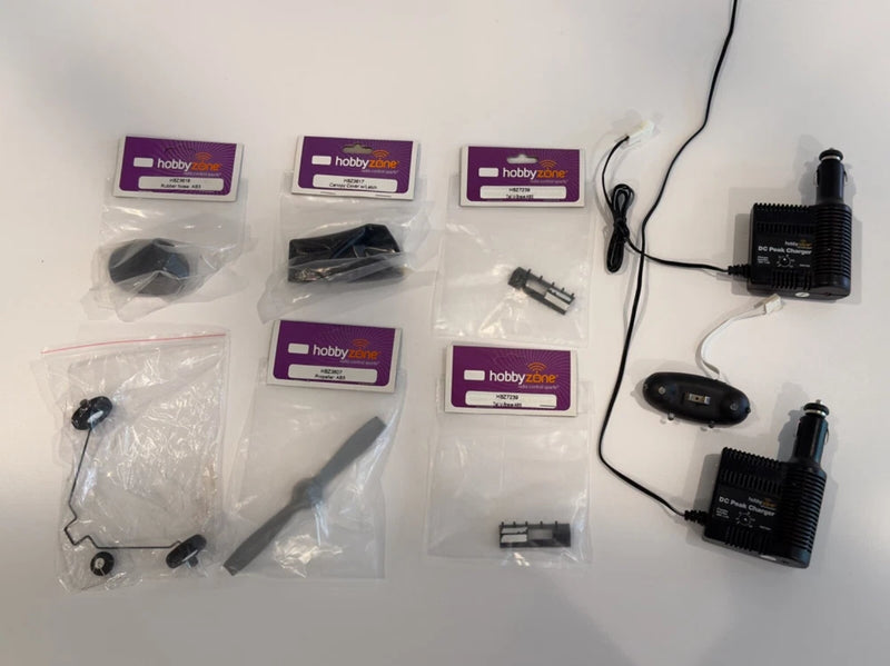 RC plane charger and sealed parts kit with two battery chargers and sealed packages