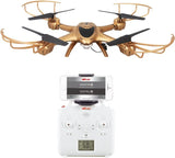 RC quadcopter drone with gold and black body and controller with screen
