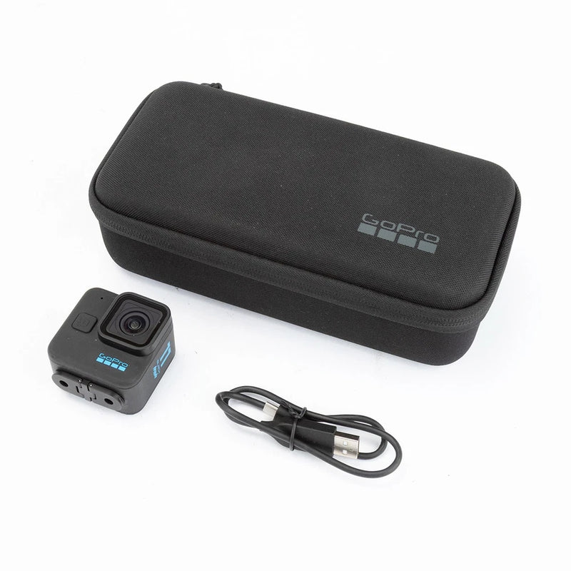 Black mini action camera with protective case and USB cable