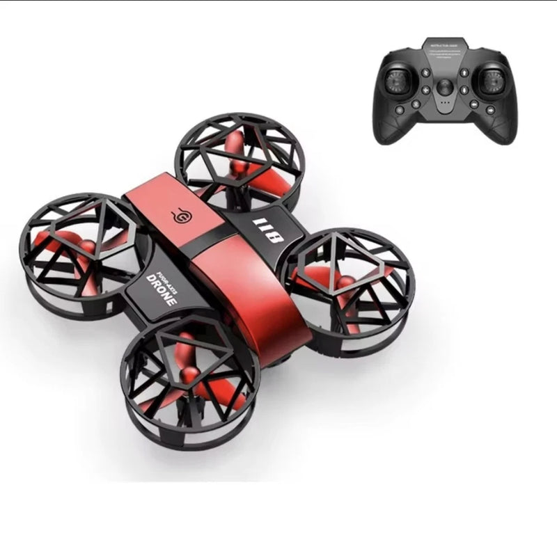 Red mini quadcopter drone with four propellers and remote controller