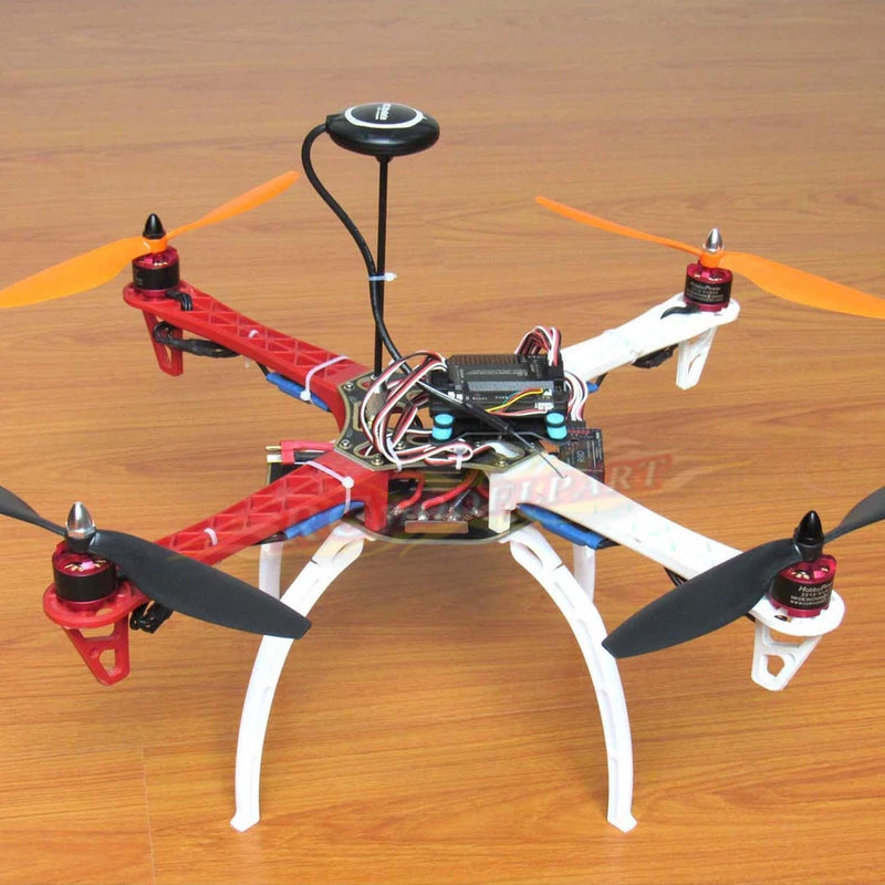 Red and white DIY quadcopter drone with four propellers and central flight controller