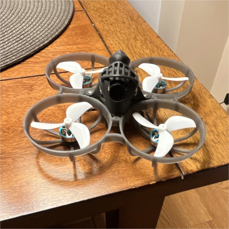 FPV miniwhoop Quadcopter Drone w/ Prop Guards, semi transparent white frame