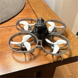 FPV miniwhoop Quadcopter Drone w/ Prop Guards, semi transparent white frame