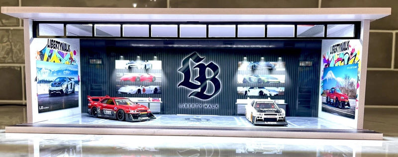 LED-lit 1:64 scale model garage diorama with cars and storefront sign
