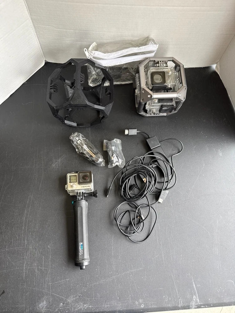 GoPro action camera bundle with housings, cables, and handheld grip/handle parts