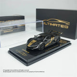 Black die-cast sports model car with gold decals on a display base