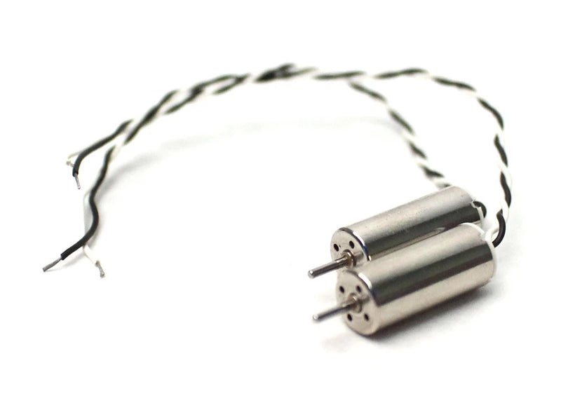 Metal motor with dual shafts and attached black wire leads