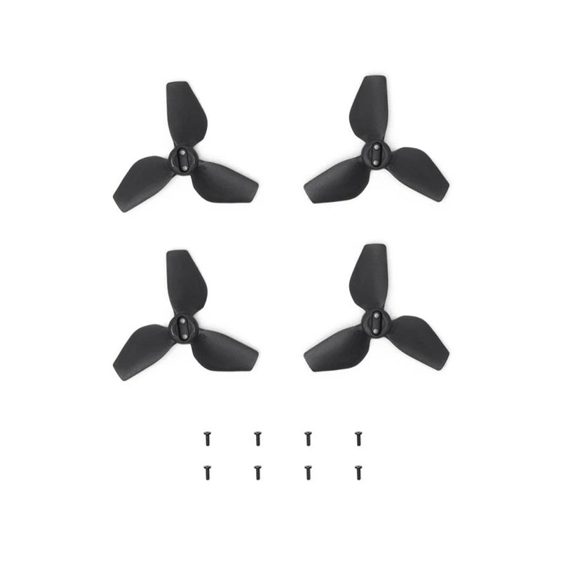 Black drone propeller set with four blade assemblies and spare screws