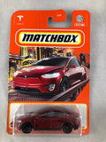 Red die-cast SUV toy car with black wheels in blister packaging