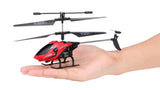 Red and black RC toy helicopter with handheld remote controller, held above a hand