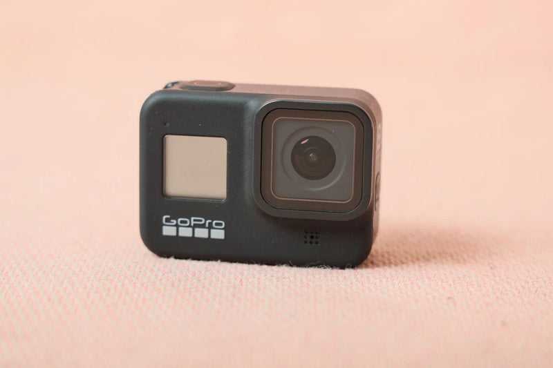 GoPro action camera front view with dark housing and large square lens cover