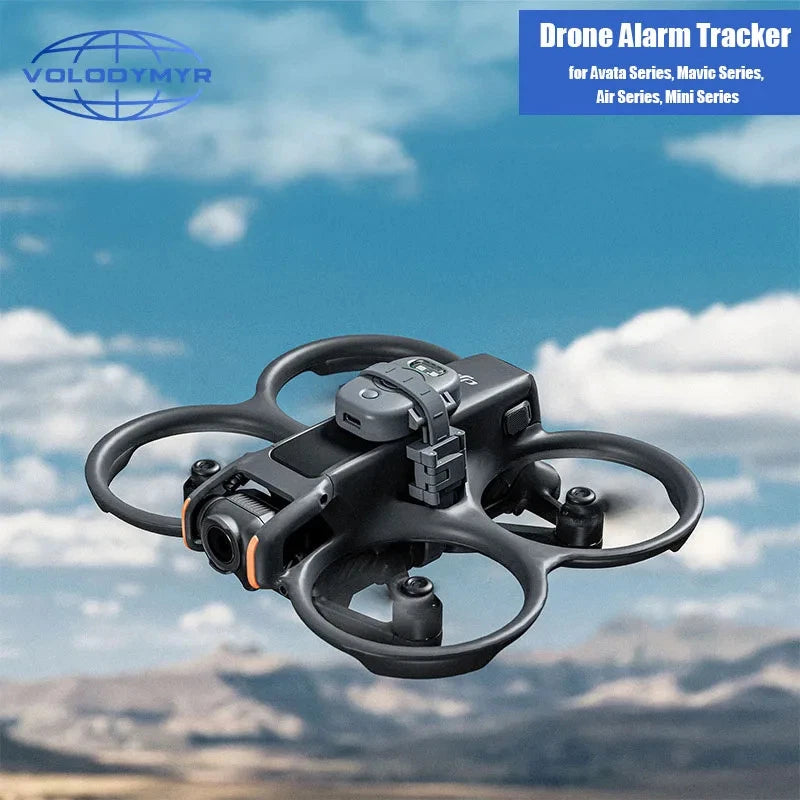 Black GPS drone alarm buzzer tracker attached to a quadcopter with cables