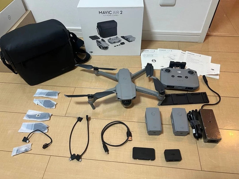 DJI Mavic Air 2 drone kit with controller, batteries, charger, and carrying case