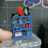 Blue mini mechanic shop shelf with engine parts and red/black battery accessories